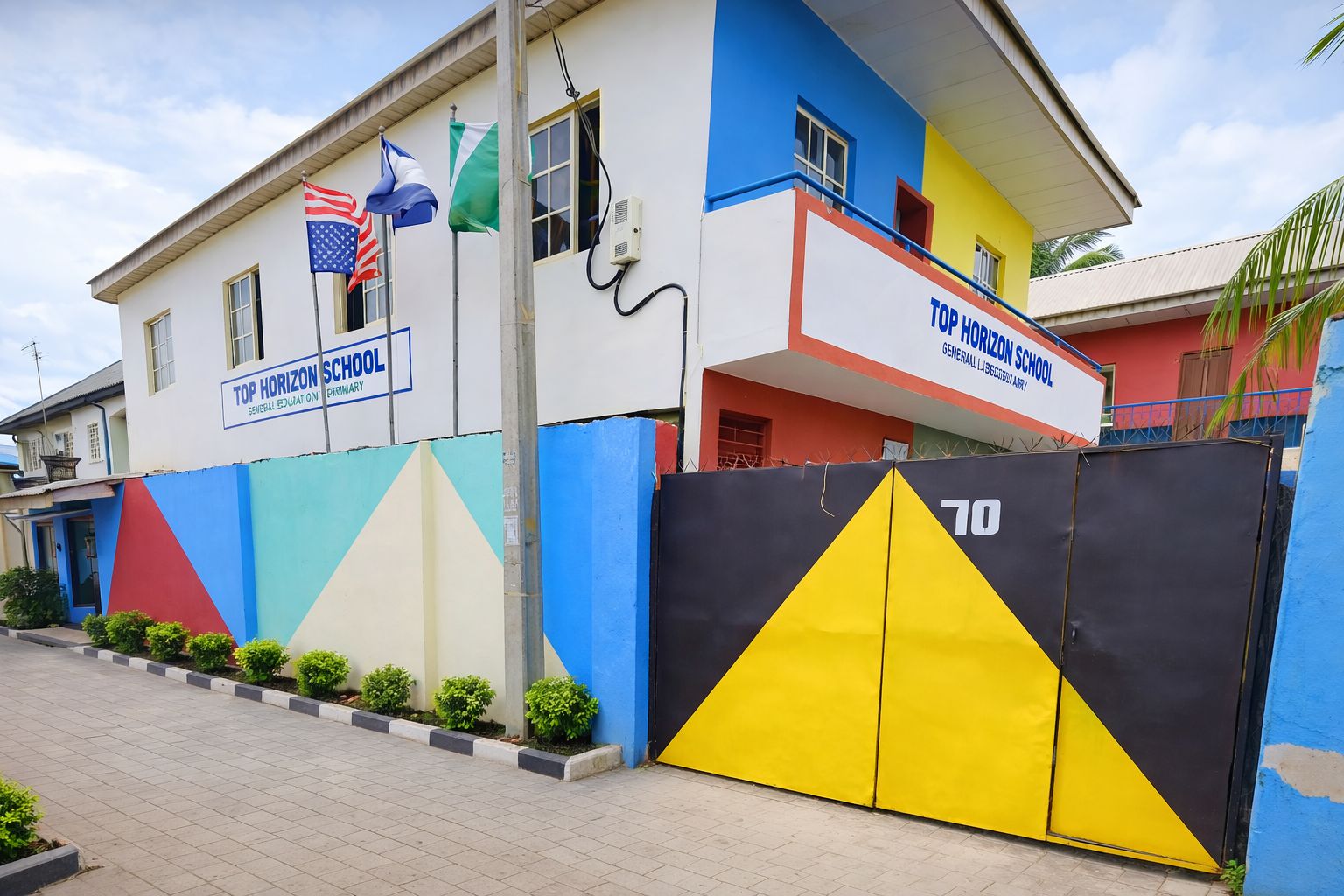 The Top Horizon school building and gate at 70 Ailegun Road